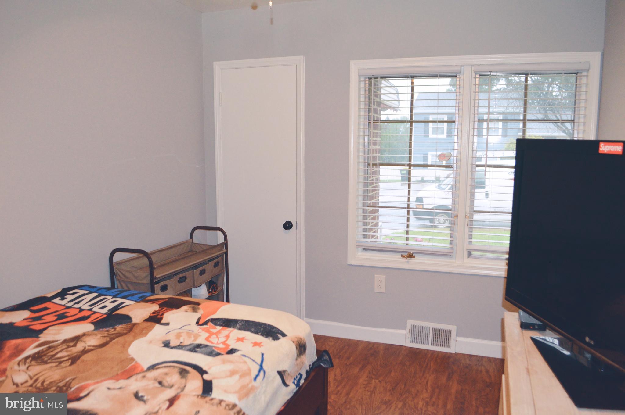 203 Mountain Road Linthicum, MD 21090 - Photo 10 of 17 a bedroom with a bed and a window