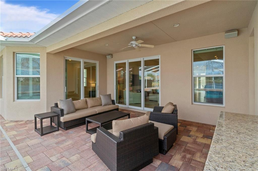 19753 Tesoro Way Estero, FL 33967 - Photo 30 of 47 a living room with furniture and windows