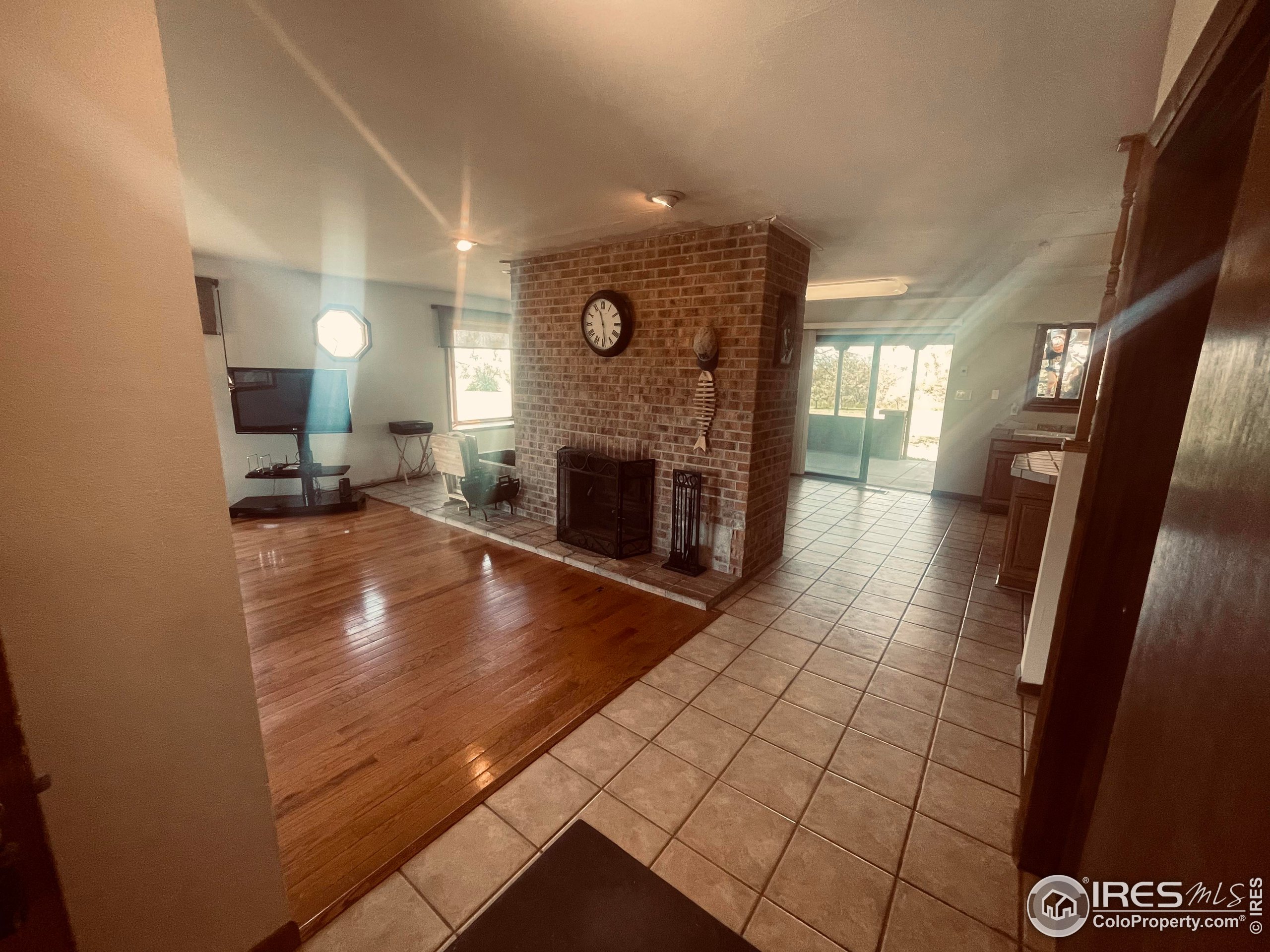 9485 County Road 15 Firestone, CO 80504 - Photo 12 of 15 a view of living room with furniture and fireplace