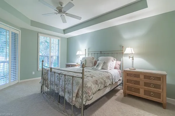 a bed room with a bed and a night stand