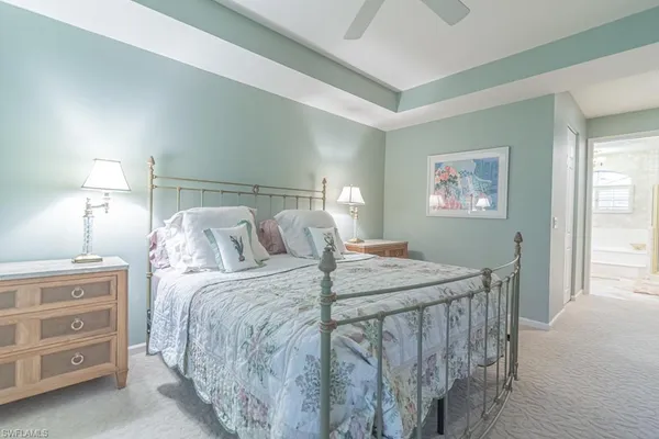 a bed room with a bed and a window