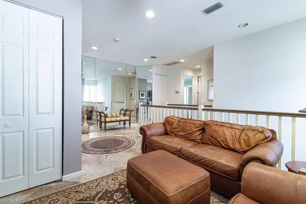a living room with furniture and a rug
