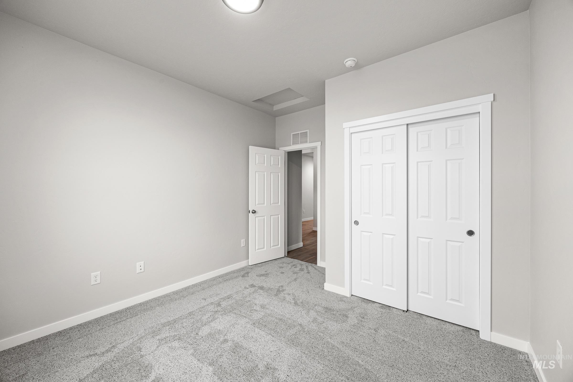 13656 Redway Court Caldwell, ID 83607 - Photo 17 of 21 Unfurnished bedroom with light colored carpet, a ceiling fan, ensuite bathroom, and recessed lighting