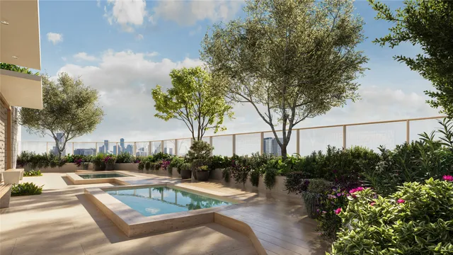 a view of swimming pool with outdoor seating and plants