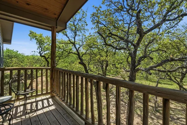 a view of balcony with wooden floor