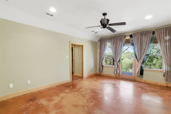 a view of an empty room with a window