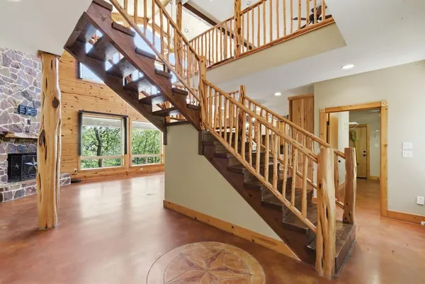 a view of an entryway with wooden floor