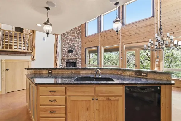 a kitchen with a sink and a window
