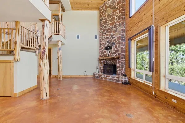 a view of an empty room with a fireplace