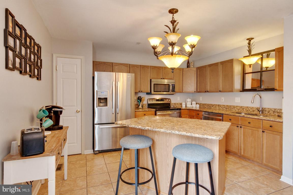 111 Sentry Ridge Smithsburg, MD 21783 - Photo 10 of 35 Kitchen island adds to prep space and eating area