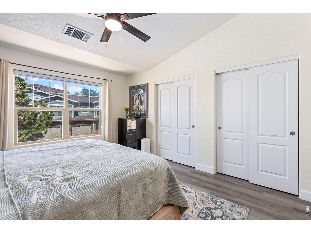5775 29th Street, Unit 811 Greeley, CO 80634 - Photo 13 of 21 a bedroom with a bed and a window