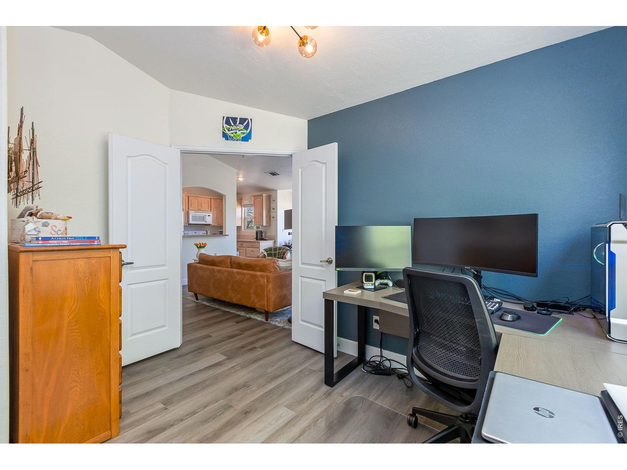 5775 29th Street, Unit 811 Greeley, CO 80634 - Photo 15 of 21 a view of a workspace with furniture and wooden floor