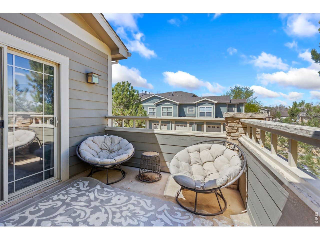 5775 29th Street, Unit 811 Greeley, CO 80634 - Photo 2 of 21 a view of a chairs and table in th balcony