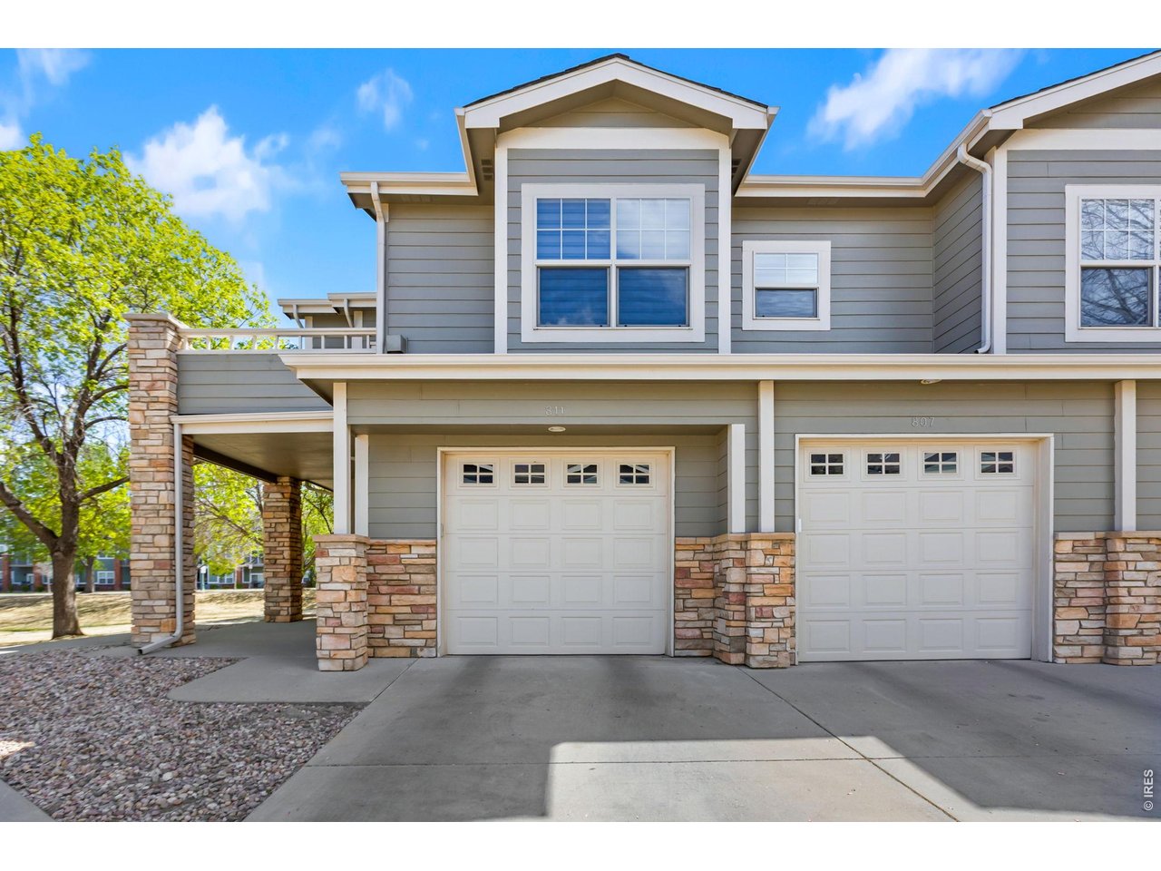 5775 29th Street, Unit 811 Greeley, CO 80634 - Photo 21 of 21 a front view of a house with a garage