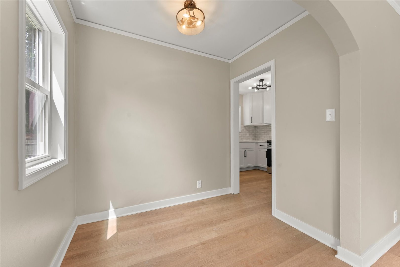 305 South Fair Street Champaign, IL 61821 - Photo 9 of 41 a view of a room with wooden floor and a window