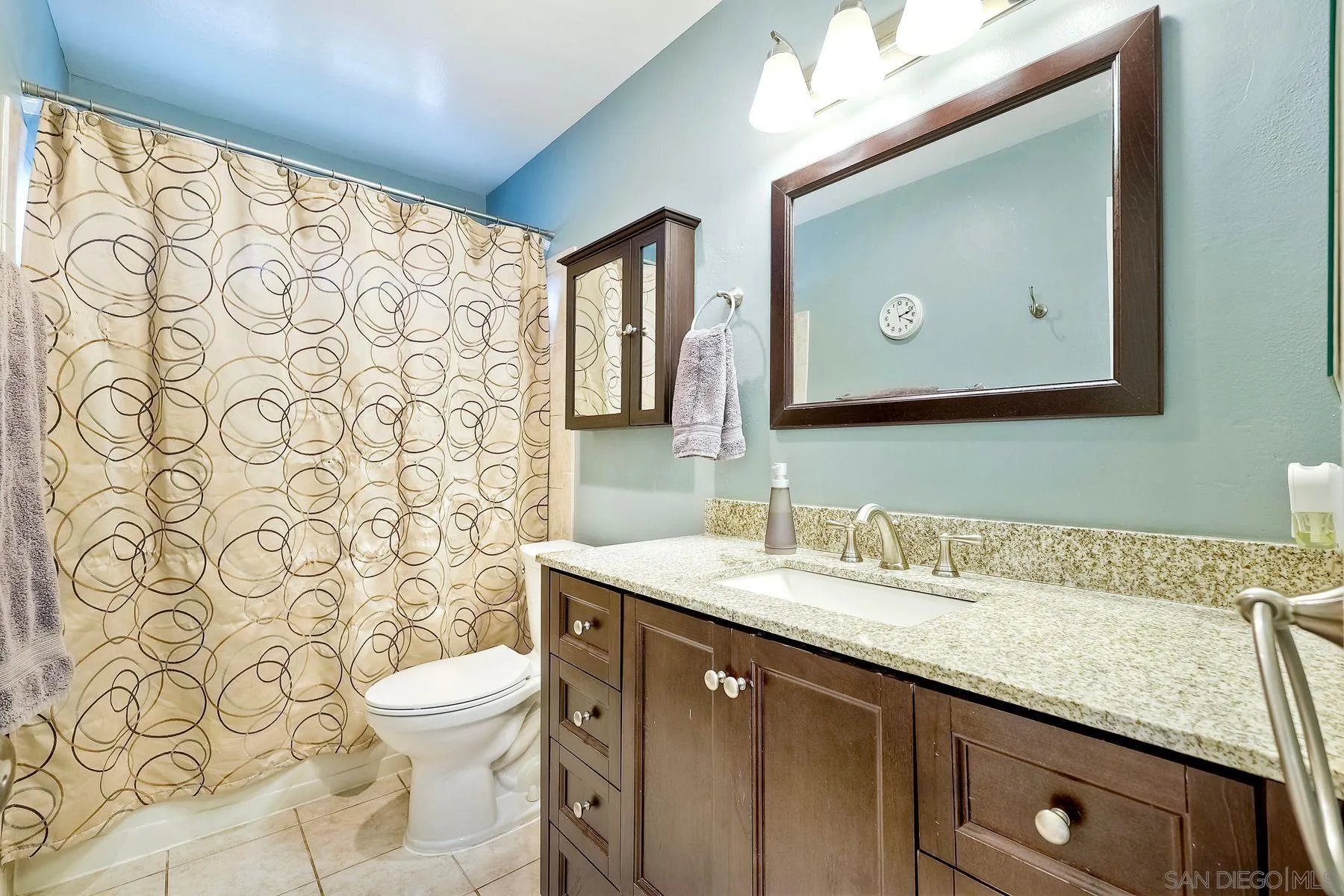 10421 Len Street Santee, CA 92071 - Photo 13 of 34 a bathroom with a granite countertop sink mirror vanity and toilet