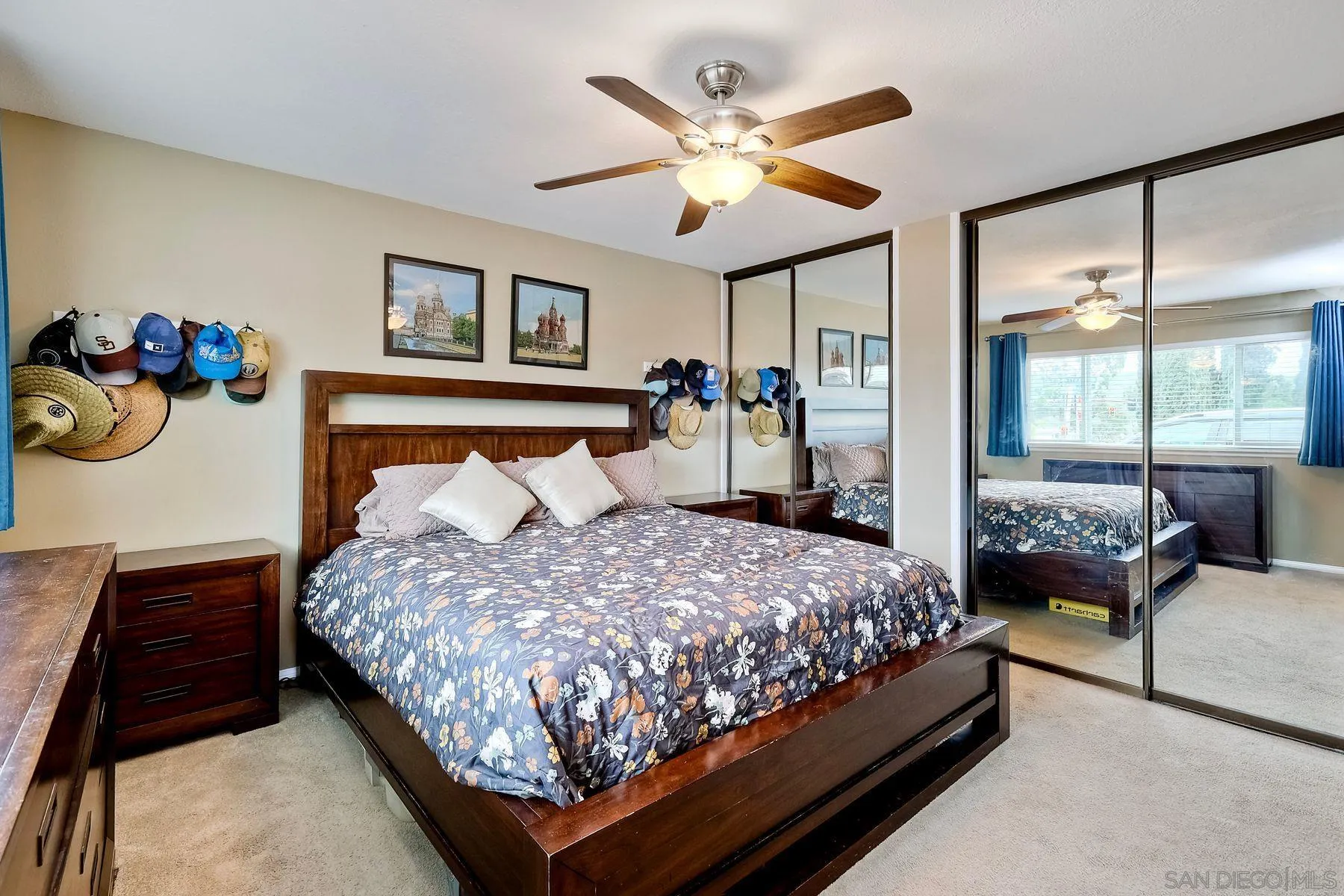 10421 Len Street Santee, CA 92071 - Photo 15 of 34 a bedroom with a bed a window and a chandelier