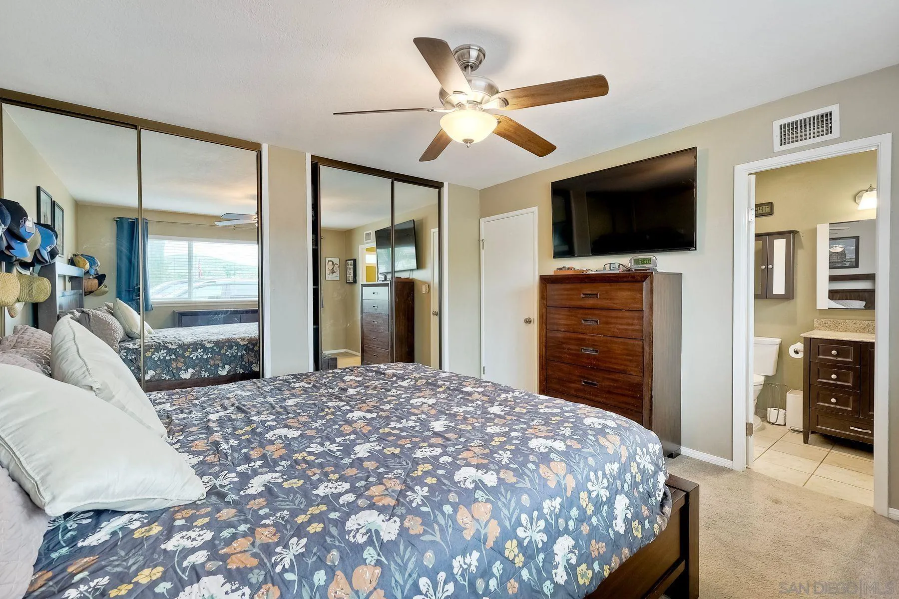 10421 Len Street Santee, CA 92071 - Photo 16 of 34 a bedroom with a bed and a flat screen tv