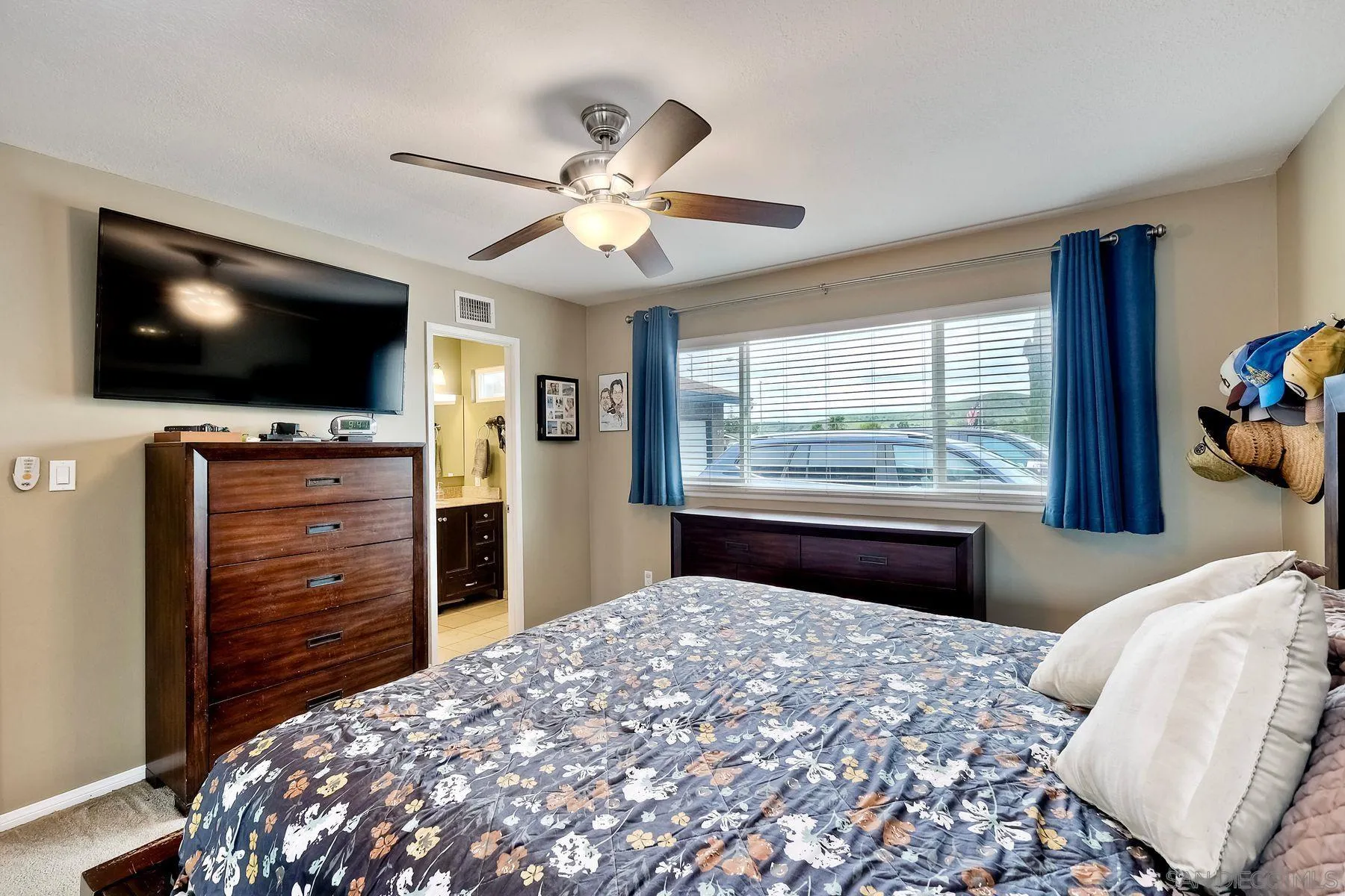 10421 Len Street Santee, CA 92071 - Photo 17 of 34 a bedroom with a bed and a flat screen tv