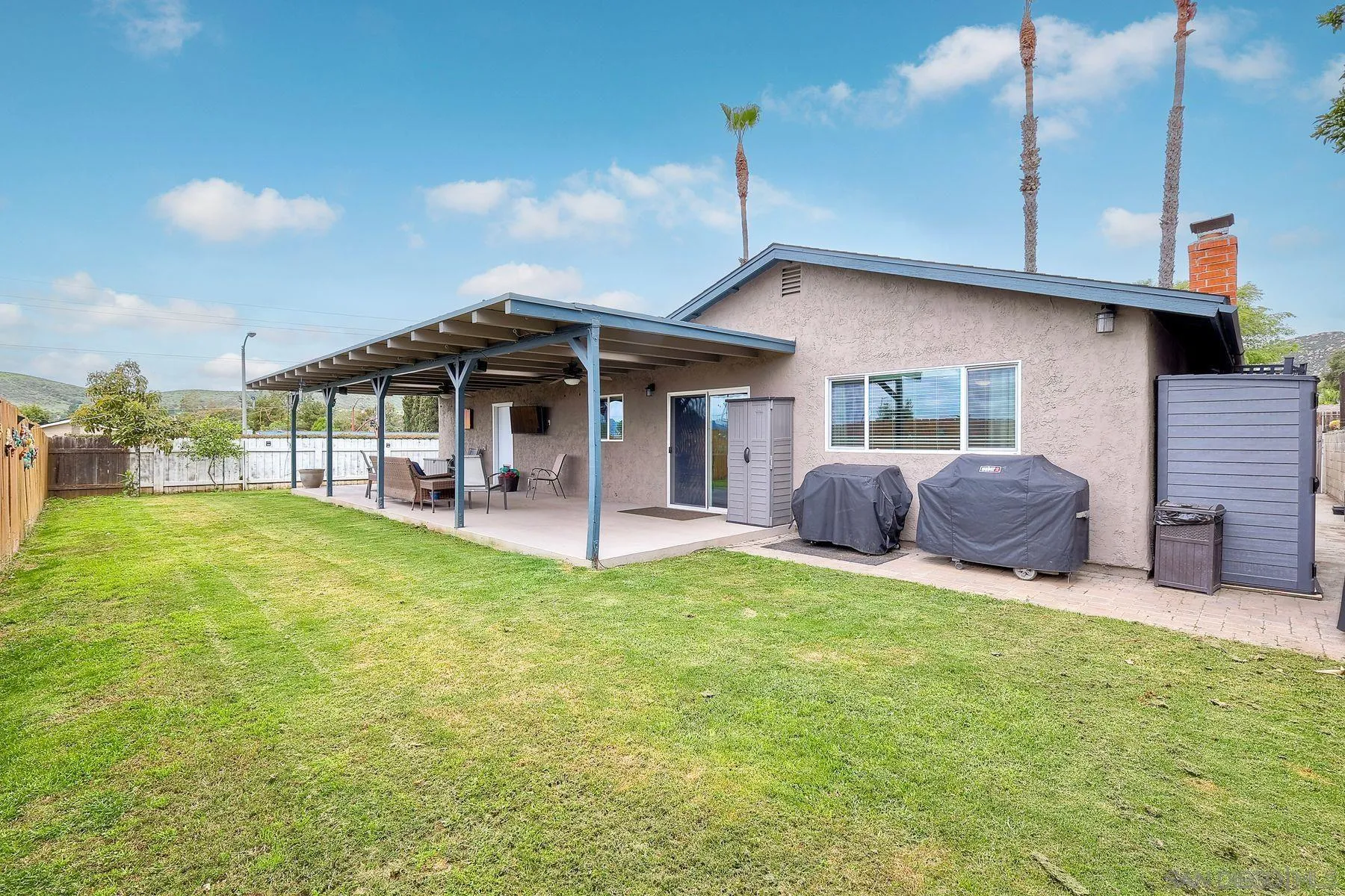 10421 Len Street Santee, CA 92071 - Photo 29 of 34 a front view of a house with a garden and patio