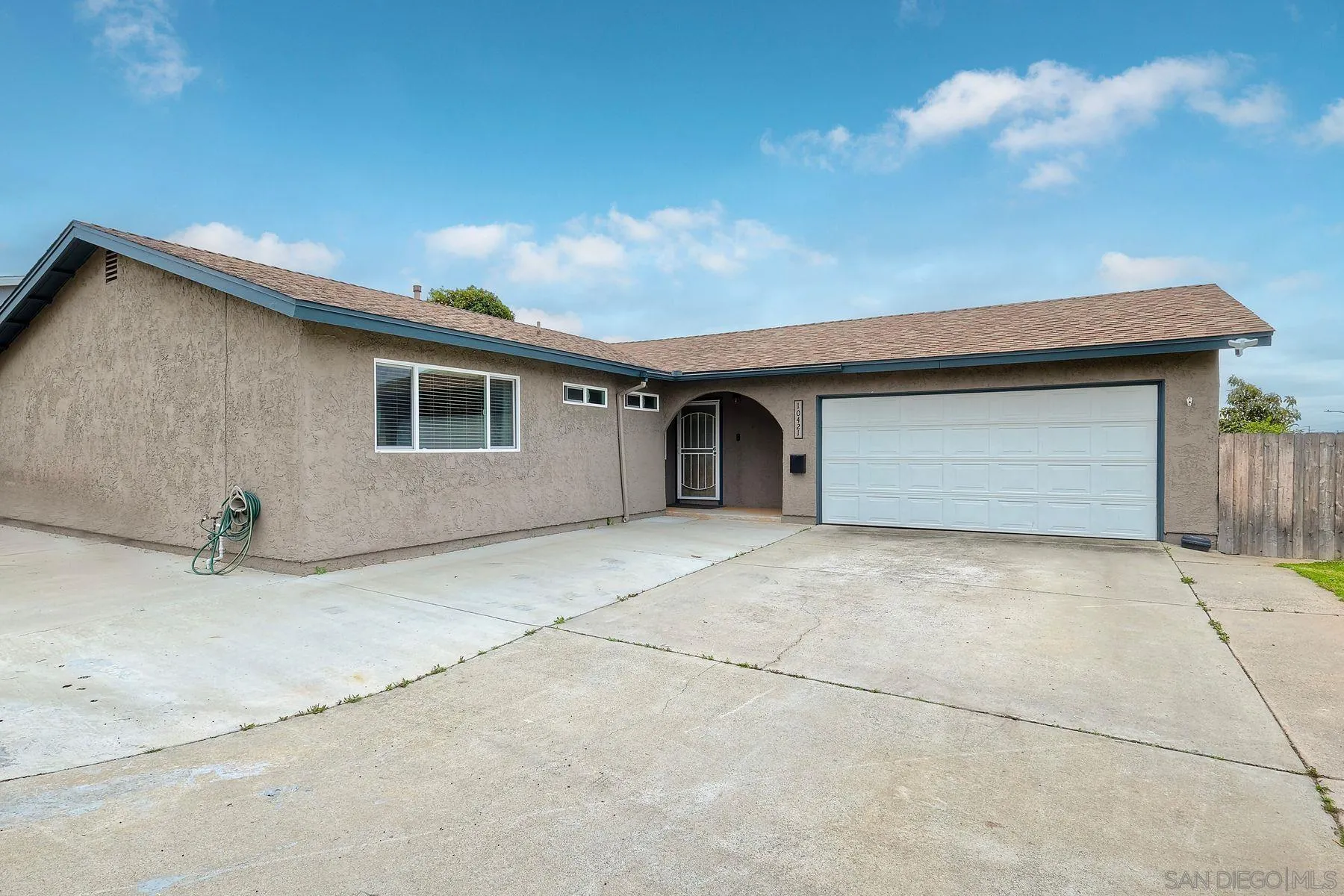 10421 Len Street Santee, CA 92071 - Photo 31 of 34 a front view of a house with a garage