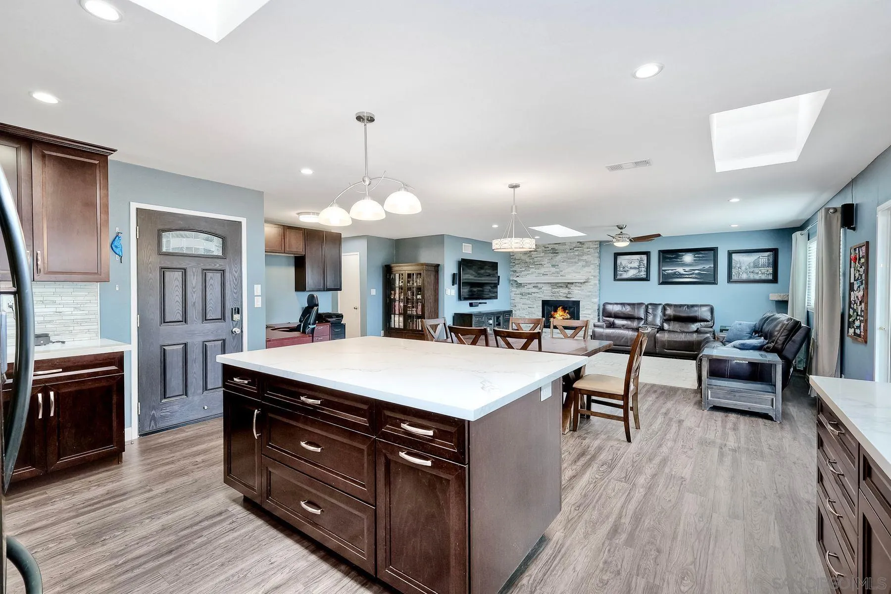 10421 Len Street Santee, CA 92071 - Photo 4 of 34 a large kitchen with kitchen island a sink a counter space and stainless steel appliances