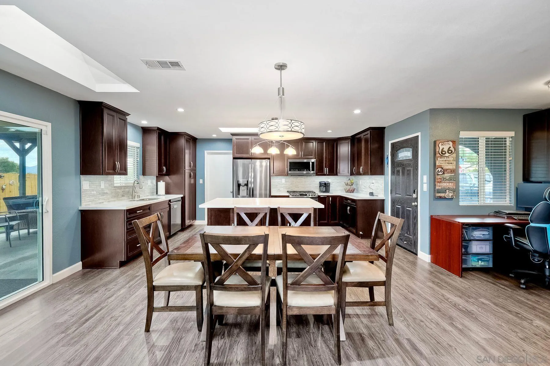 10421 Len Street Santee, CA 92071 - Photo 8 of 34 a view of a dining room with furniture window and wooden floor