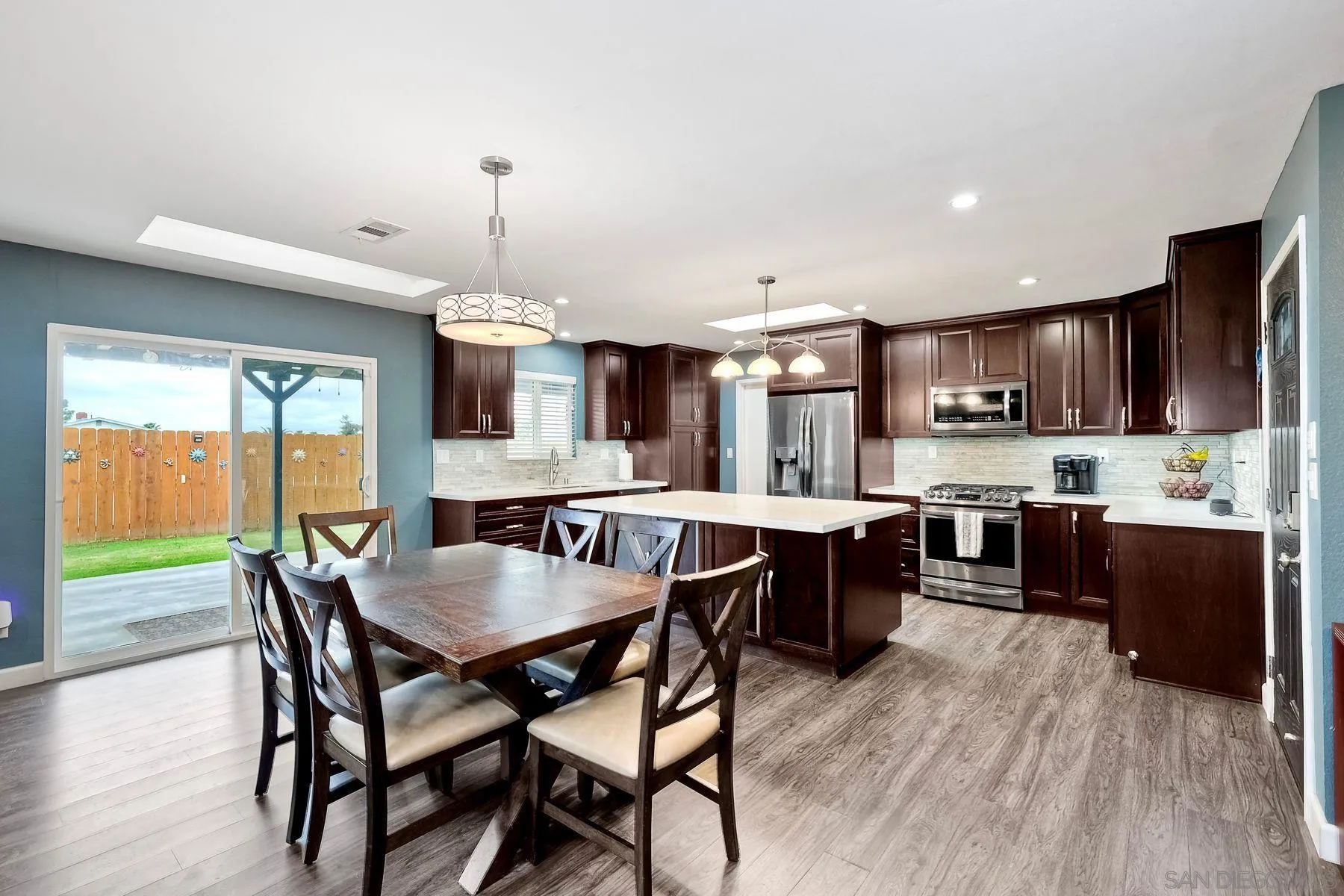 10421 Len Street Santee, CA 92071 - Photo 9 of 34 a large kitchen with a table and chairs in it