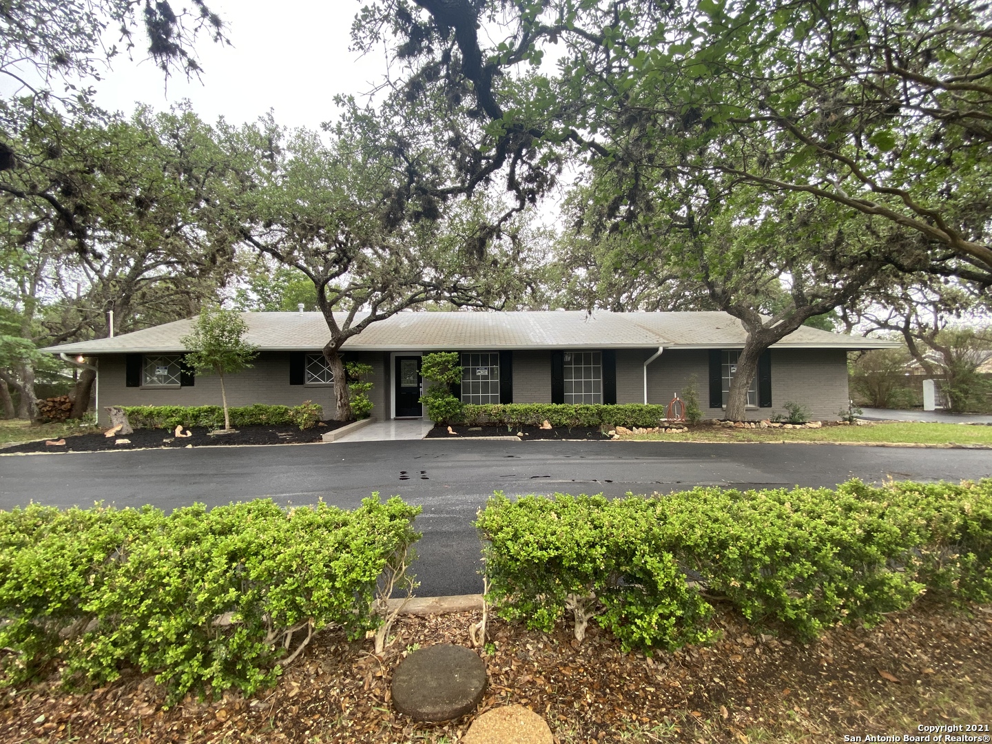 132 Wagon Trail Road Shavano Park, TX 78231 - Photo 1 of 1 a front view of a house with garden