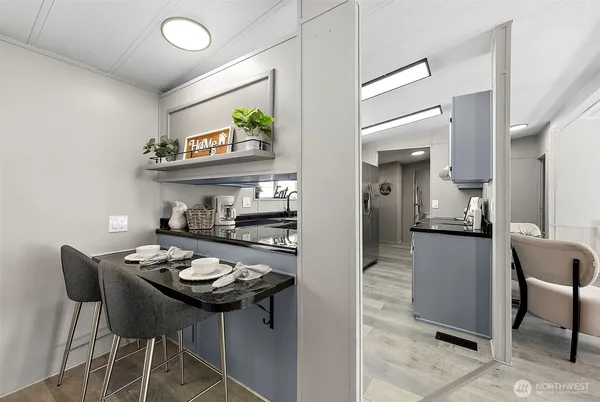 a kitchen with a table and chairs in it