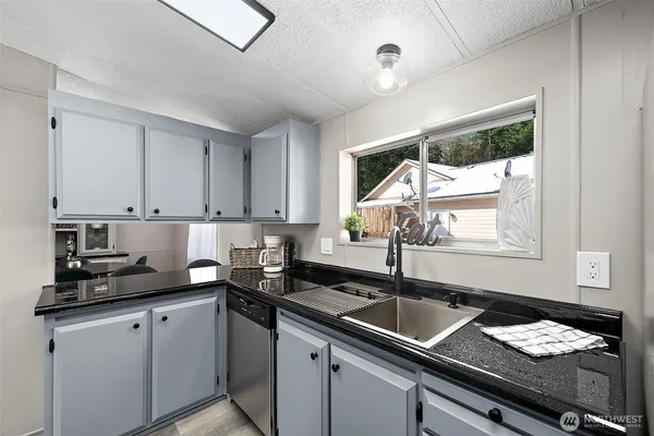 a kitchen with a sink and cabinets