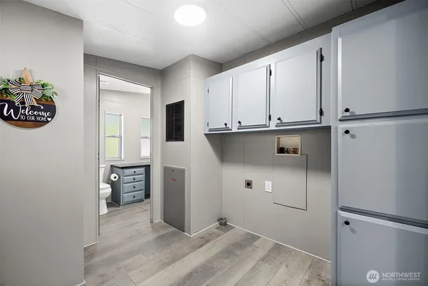 a view of kitchen with refrigerator and window