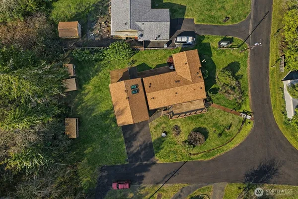 an aerial view of a house with a garden