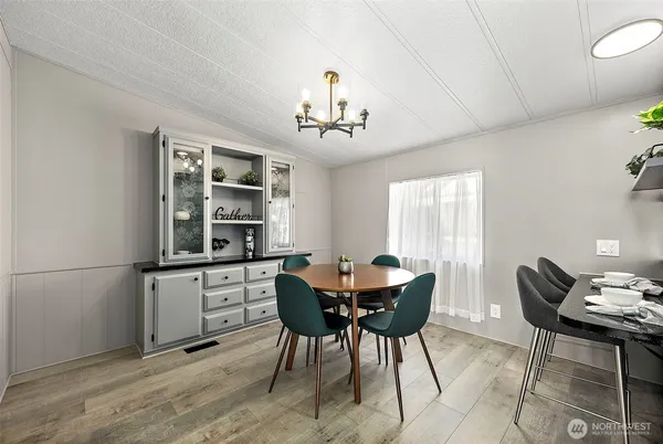 a view of a dining room with furniture and window