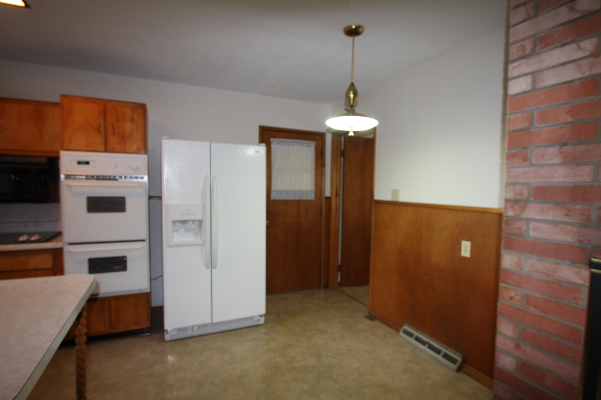 119 North Seneca Road Oak Ridge, TN 37830 - Photo 5 of 20 a view of a kitchen with stainless steel appliances wooden floor and a window