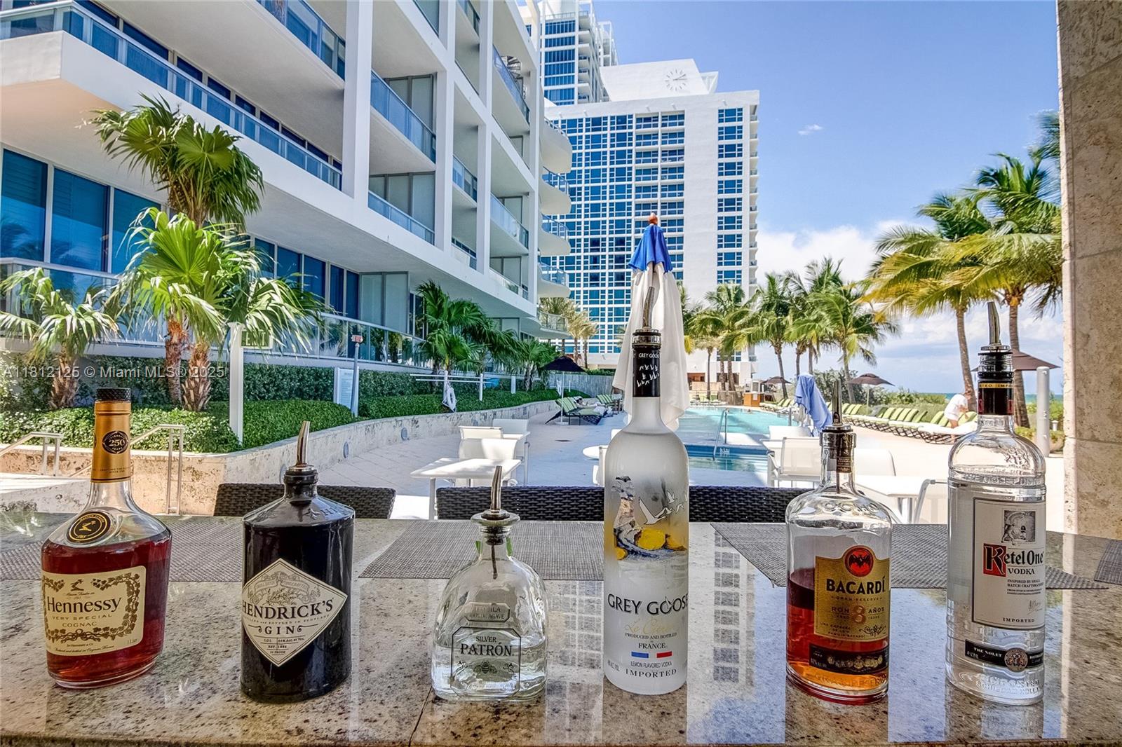 6801 Collins Avenue, Unit 510 Miami Beach, FL 33141 - Photo 20 of 21 outdoor bar with food and beverage service available at 1 of 4 pools