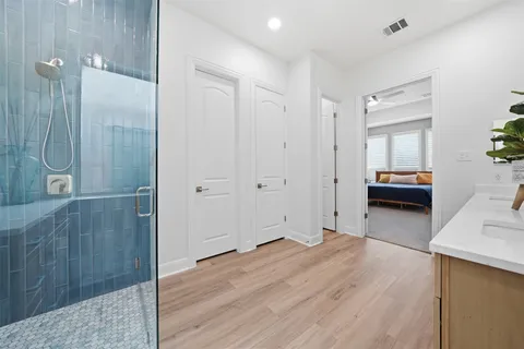 a view of hallway with wooden floor