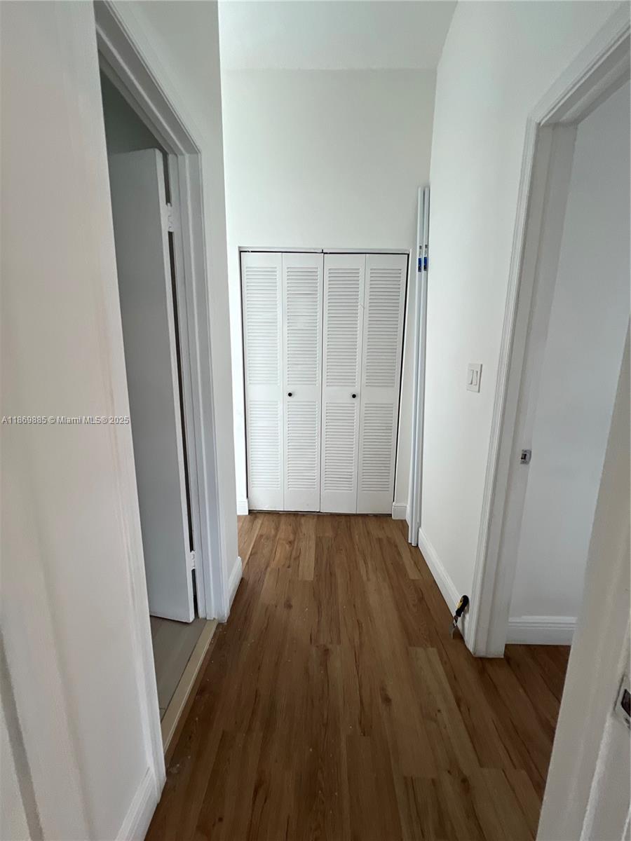 Snapper Creek Townhouses Miami, FL 33173 - Photo 11 of 20 a view of a hallway with wooden floor