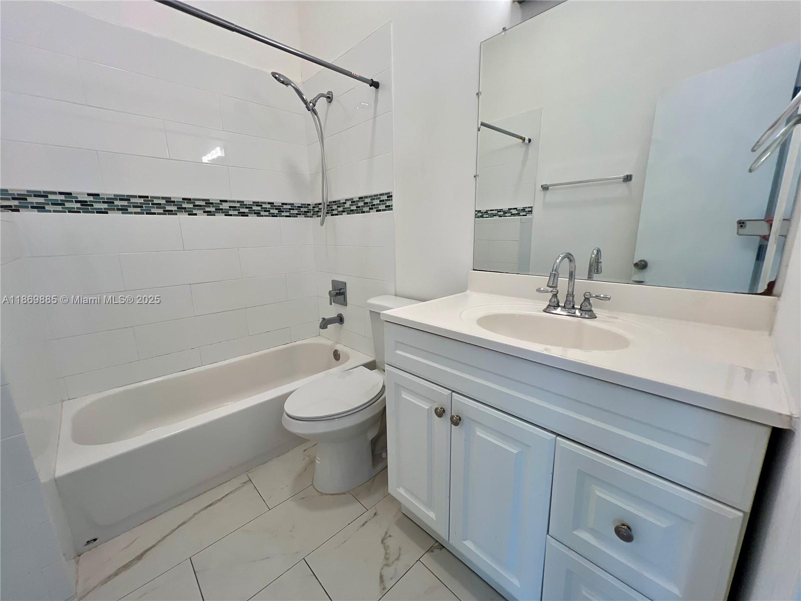 Snapper Creek Townhouses Miami, FL 33173 - Photo 15 of 20 a bathroom with a sink a toilet and shower