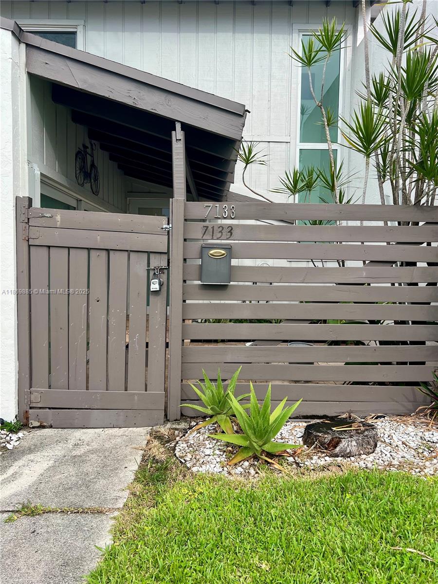 Snapper Creek Townhouses Miami, FL 33173 - Photo 20 of 20 a front view of a house with a yard