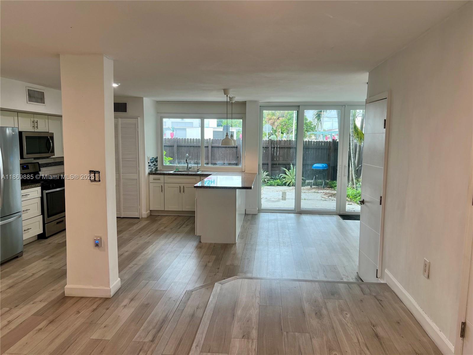 Snapper Creek Townhouses Miami, FL 33173 - Photo 3 of 20 a view of a living room and a wooden floor