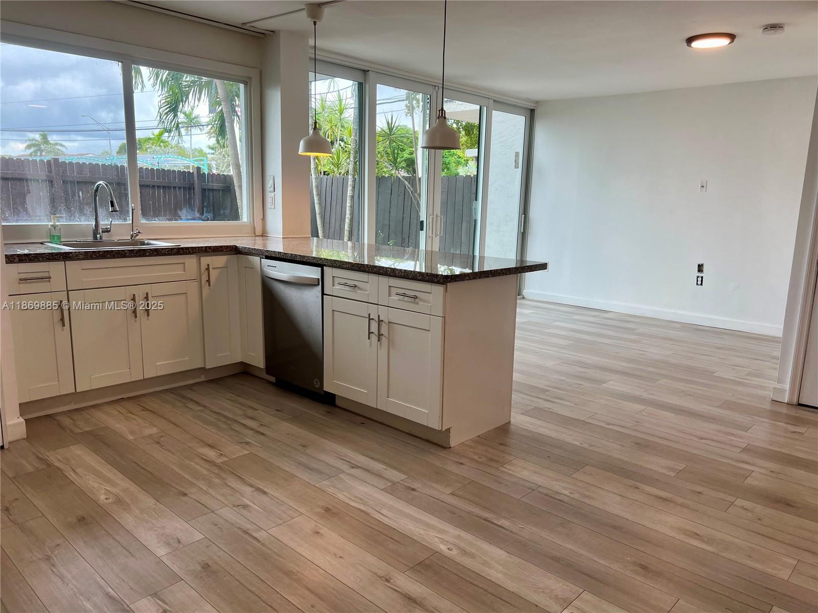 Snapper Creek Townhouses Miami, FL 33173 - Photo 4 of 20 a kitchen with stainless steel appliances granite countertop a stove a sink and a refrigerator