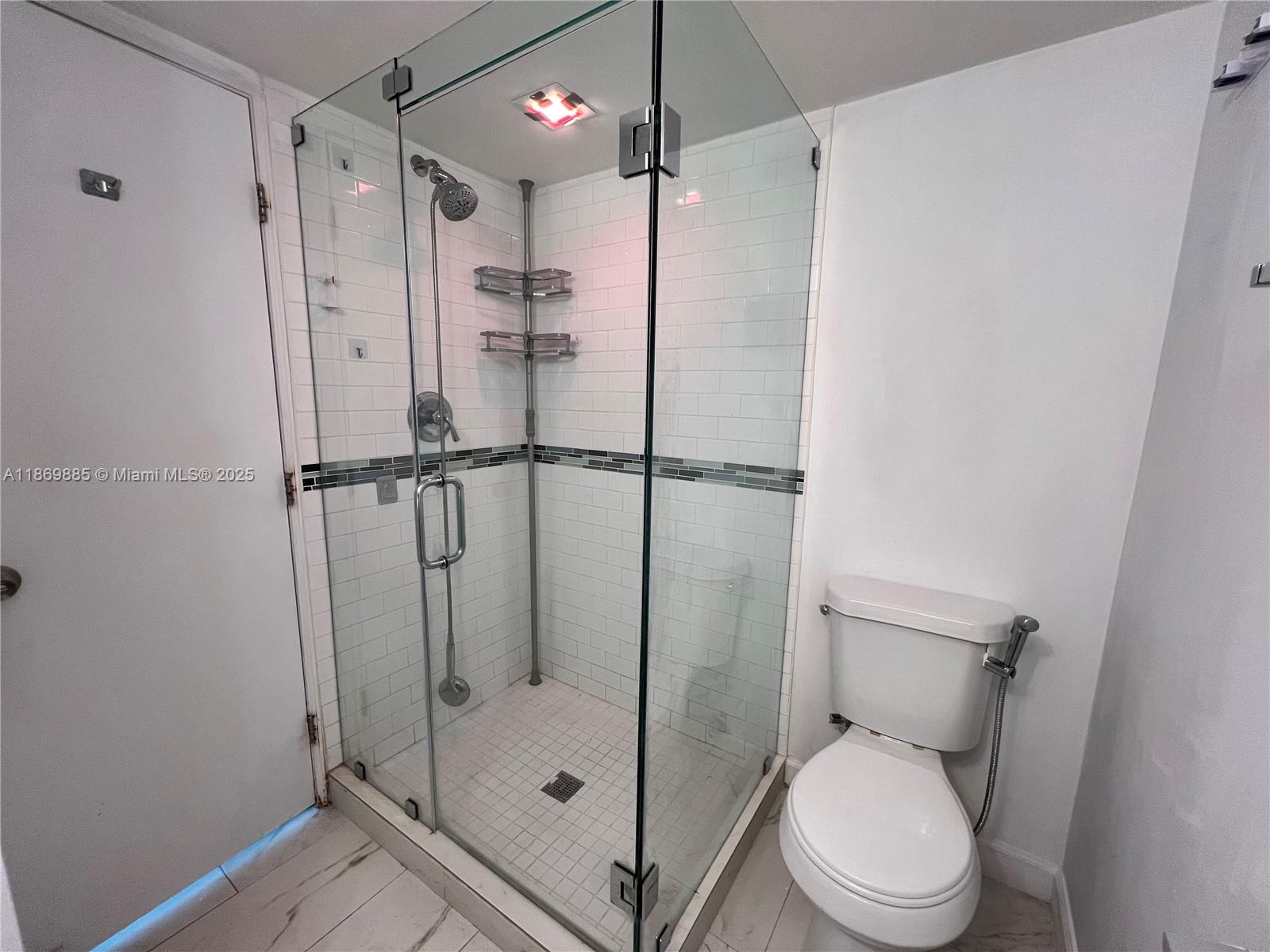 Snapper Creek Townhouses Miami, FL 33173 - Photo 8 of 20 a bathroom with a toilet and a shower