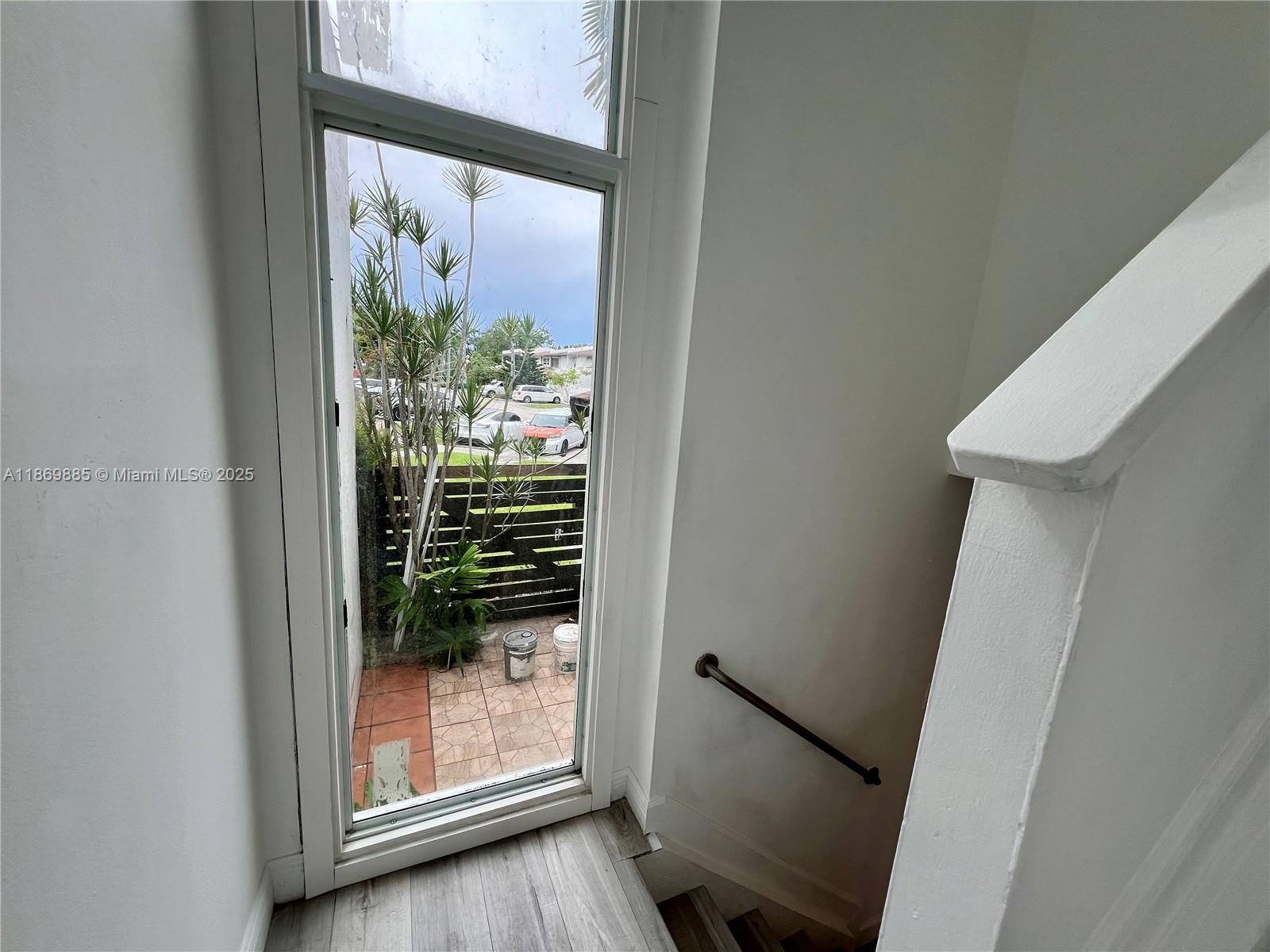 Snapper Creek Townhouses Miami, FL 33173 - Photo 10 of 20 a view of a glass door and a window