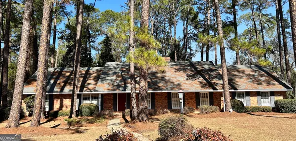 a view of house with outdoor space and sitting space