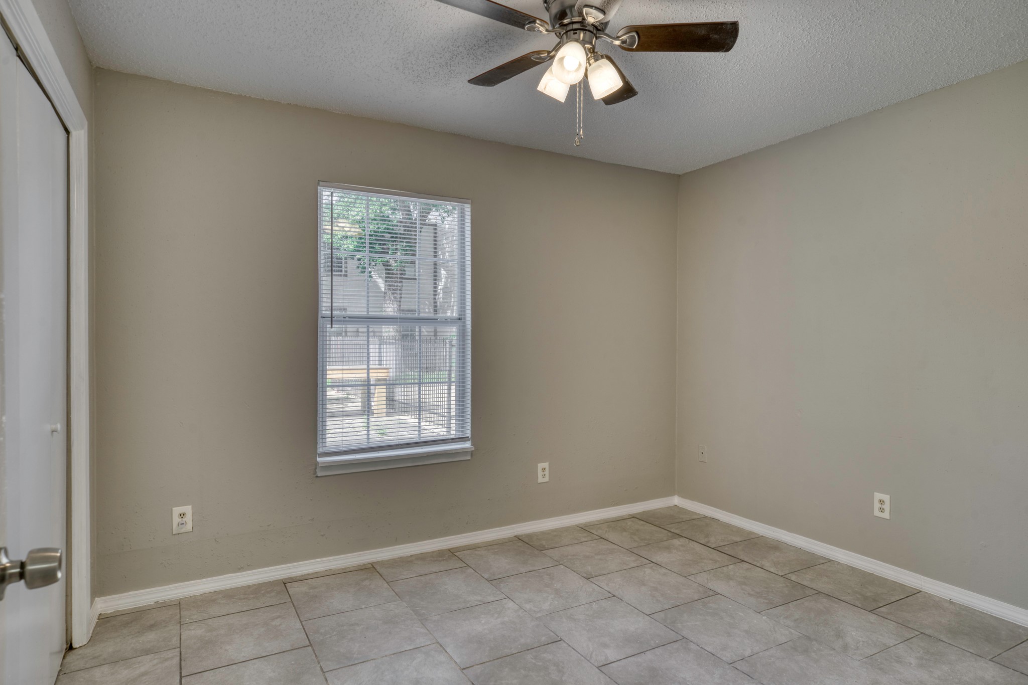 2000 Kazmeier Plaza Bryan, TX 77802 - Photo 20 of 23 an empty room with windows and fan