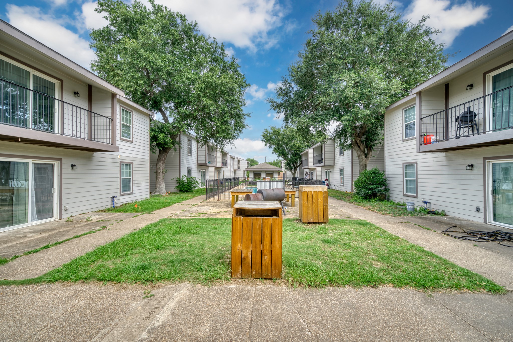 2000 Kazmeier Plaza Bryan, TX 77802 - Photo 9 of 23 a view of a backyard with table and chairs wooden fence