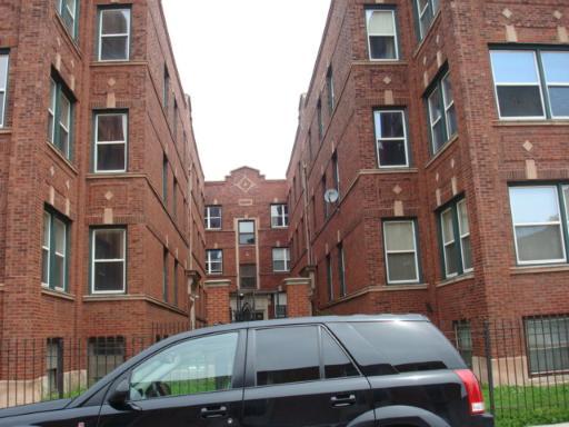 820 East 44th Street, Unit 2 Chicago, IL 60653 - Photo 1 of 1 a view of a brick building with many windows