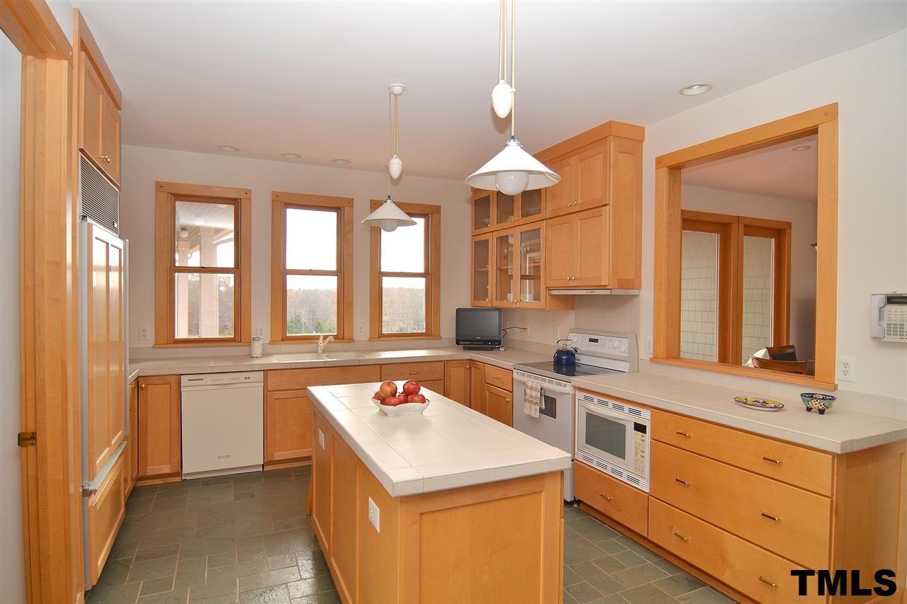 7411 Bill Poole Road Rougemont, NC 27572 - Photo 11 of 25 Great Cabinet Storage, Walk-In Pantry & Wood Stove.