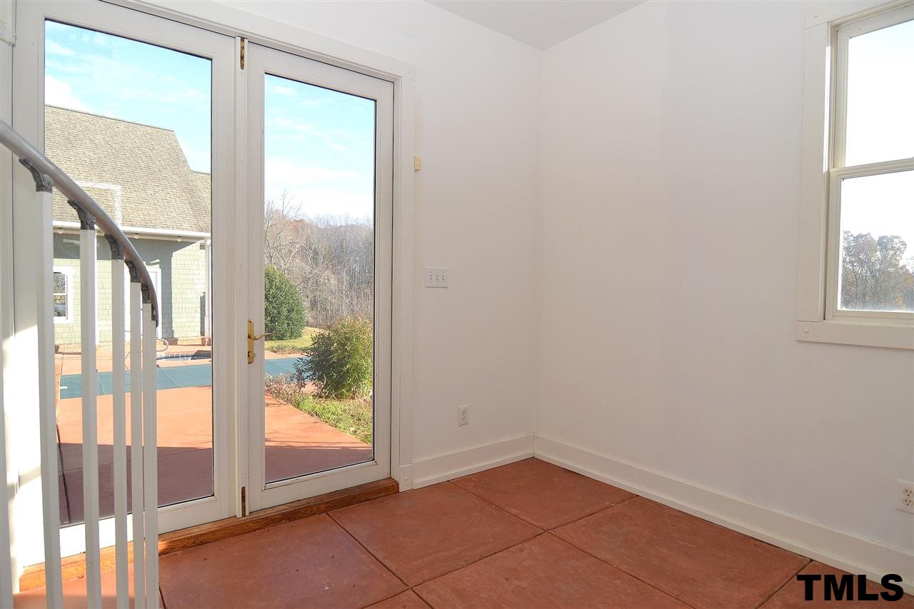 7411 Bill Poole Road Rougemont, NC 27572 - Photo 17 of 25 Inside Pool Room for Dressing w/ Full Bath, Tile Floor & Storage Closet.